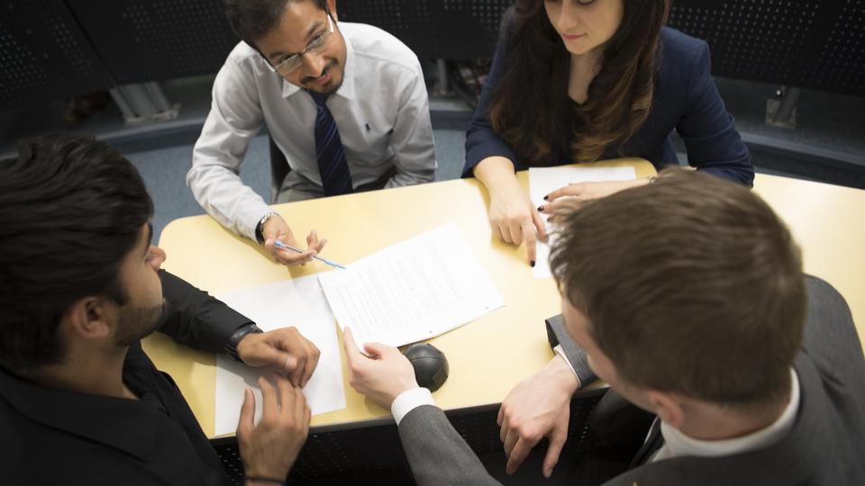 students collaborating on a project in class