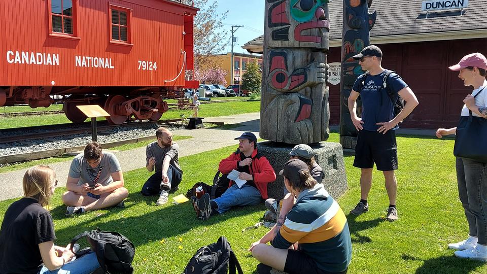 students and teachers hanging around outside on a sunny day in downtown Duncan
