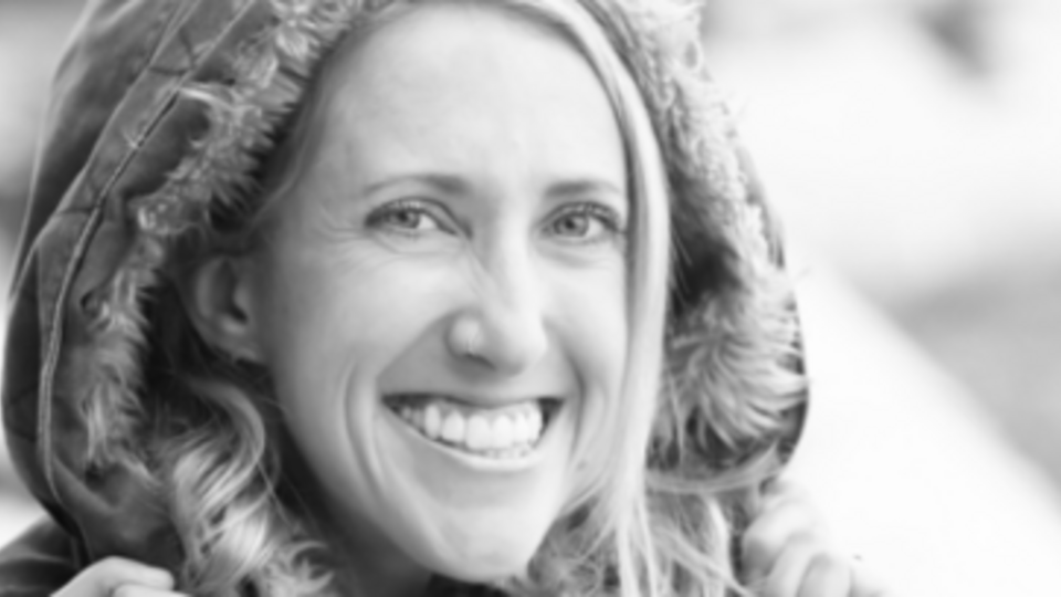 Headshot of Haley Healey, blond woman in her 30s in a hooded coat.