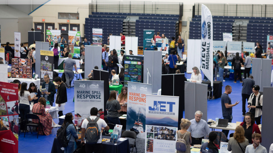 image of people attending a career fair in the VIU gymnasium