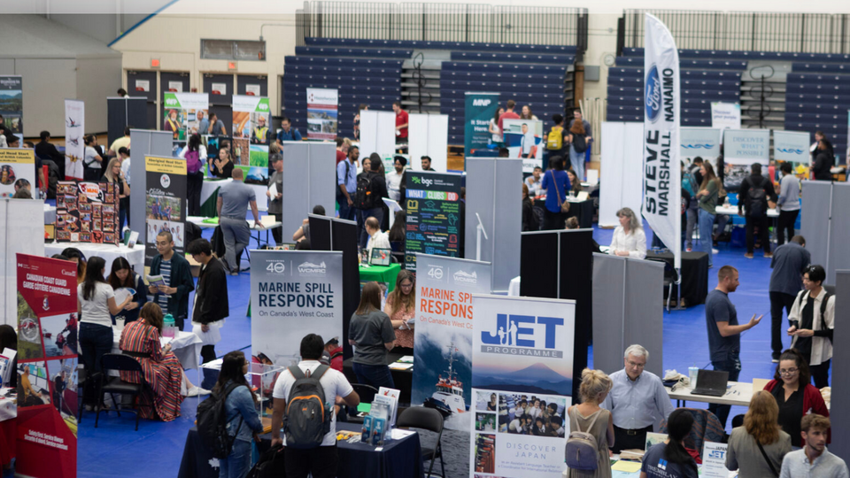 image of people attending a career fair in the VIU gymnasium