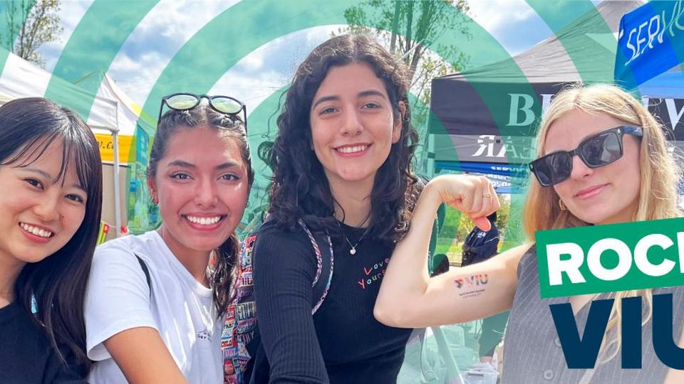 Four students show off their VIU temporary tattoos