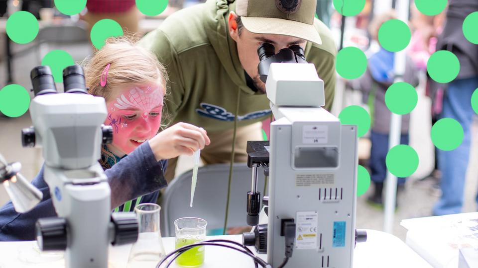 daughter and father using science equipment