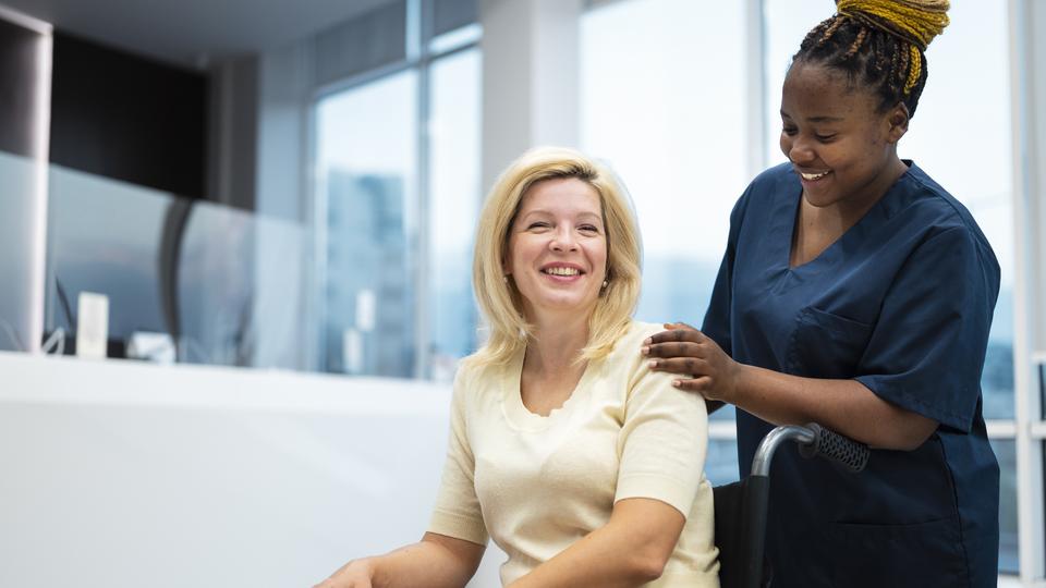 smiling attendant with patient
